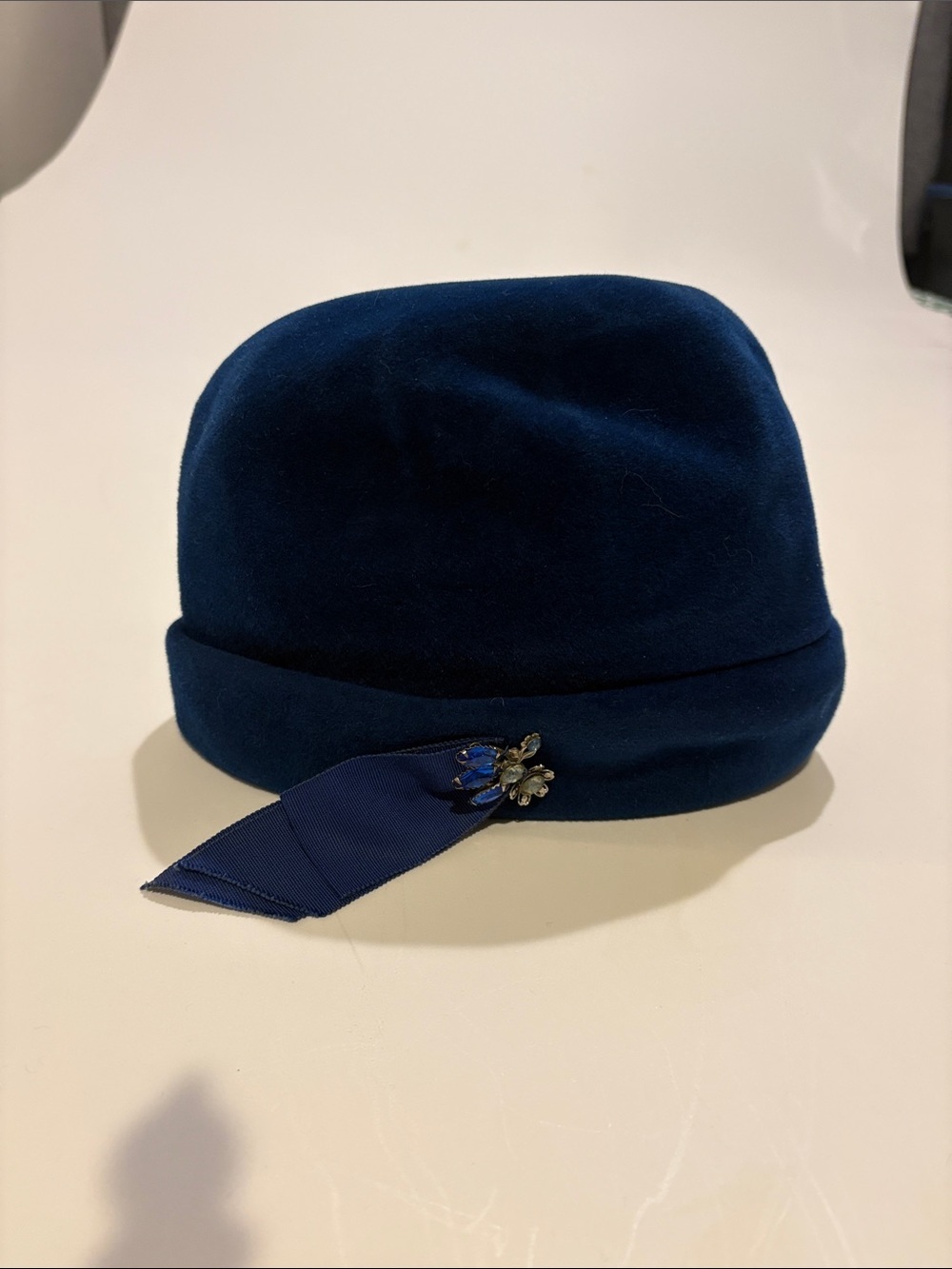 Women's Navy Felt Cloche Hat with Ribbon and Brooch Detail